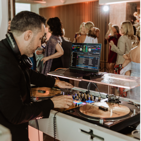 Staten Island DJ performing at a lively event, engaging the crowd.