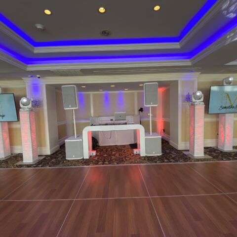 Modern futuristic DJ booth with glowing lights.