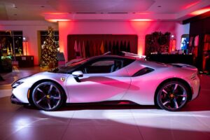 Ferrari car display at corporate event featuring cohesive red branding