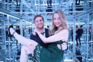 Guests enjoying the House of Mirrors photobooth with reflective mirrors