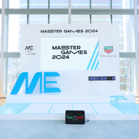 Custom stage backdrop with corporate branding at an event.