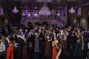Guests enjoying a wedding reception in an elegant ballroom.
