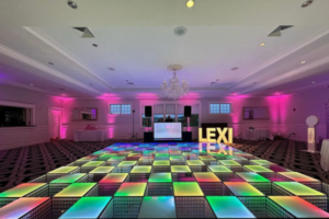 A colorful LED dance floor at an event, lighting up in sync with music for an interactive dance experience.