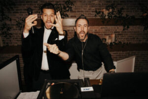 DJ and MC working together, creating a lively atmosphere and interacting with guests.