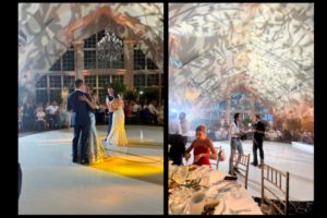 Couple dancing under warm, artistic lighting in a venue with chandeliers