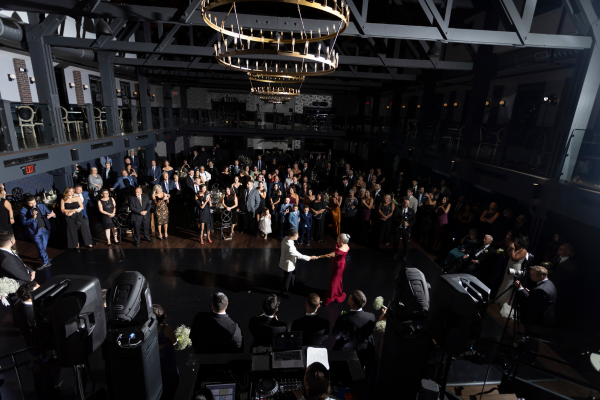 Group of guests dancing and celebrating at a wedding reception