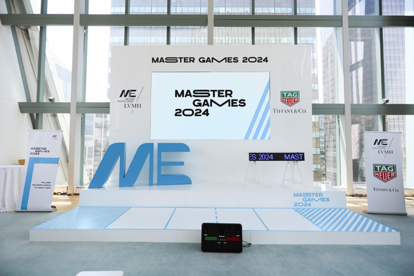 Modern stage setup with LED screen for a marketing event plan.