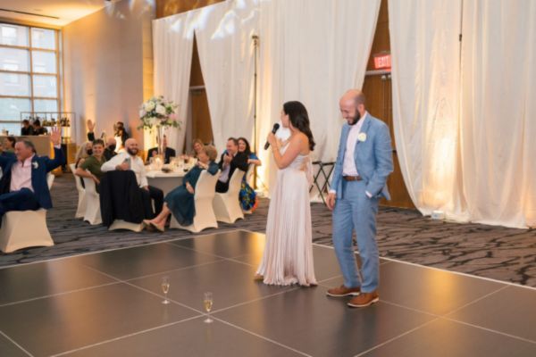 Bridesmaid gives a speech during a wedding reception.