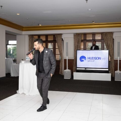 A DJ and MC hosting a corporate event.