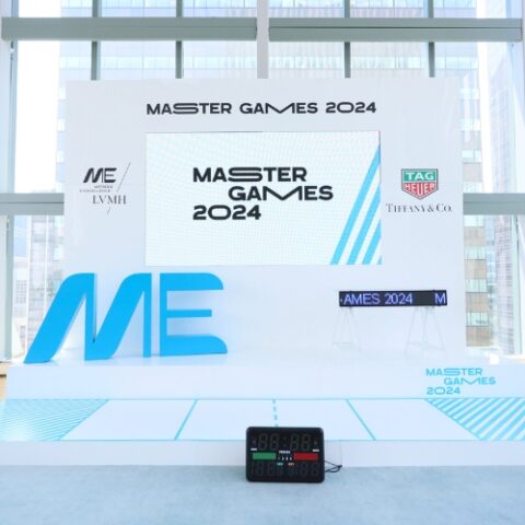 Custom-built stage with branded backdrop and LED display.