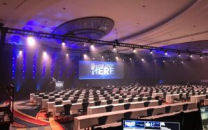 Large-scale LED video wall at a corporate conference.