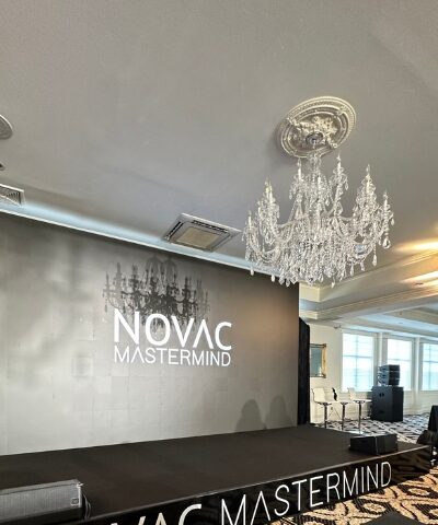 Novac Mastermind stage with LED backdrop.