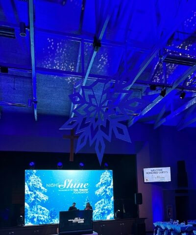 Christmas-themed LED video wall with blue lighting.
