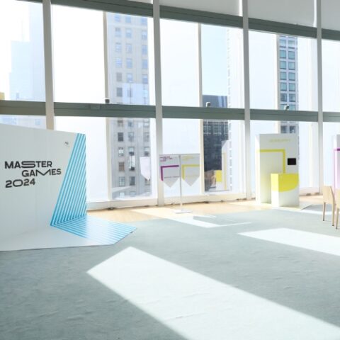 Minimalist event production setup with branded product displays.