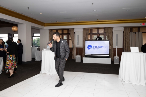 Corporate MC and DJ guide a branded event.