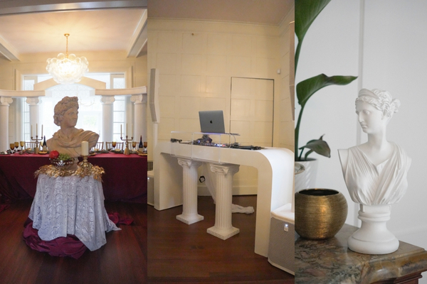 Roman themed party decor with busts and DJ booth