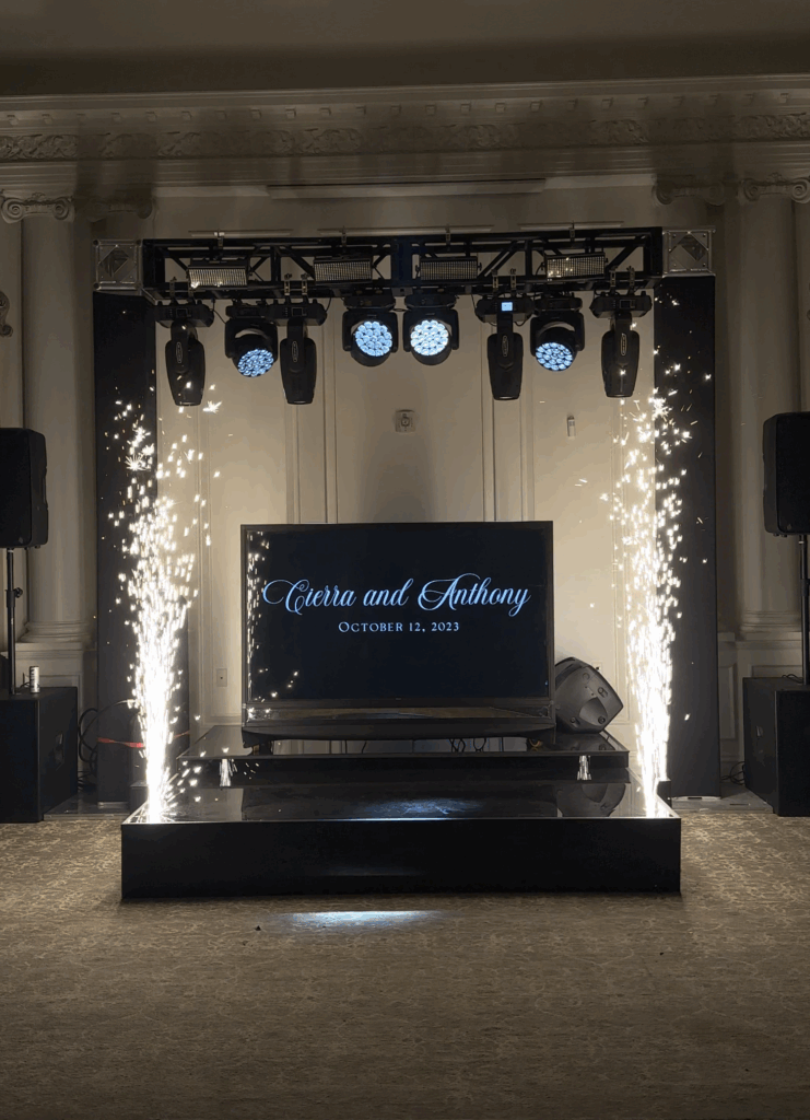 Stage and DJ booth with sparks and truss