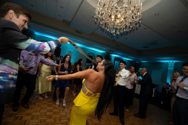 Teal uplighting on wedding dance floor