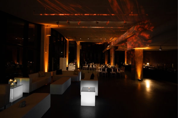 Amber uplighting at modern wedding reception venue