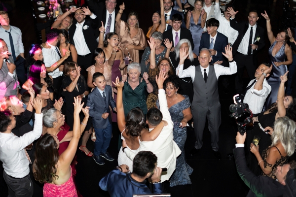 Wedding guests dancing with high energy