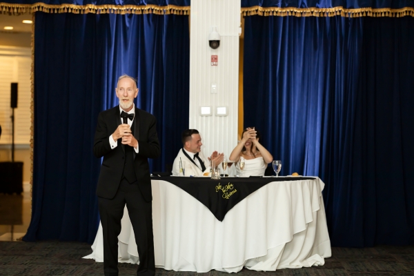 Father starting a speech at wedding 