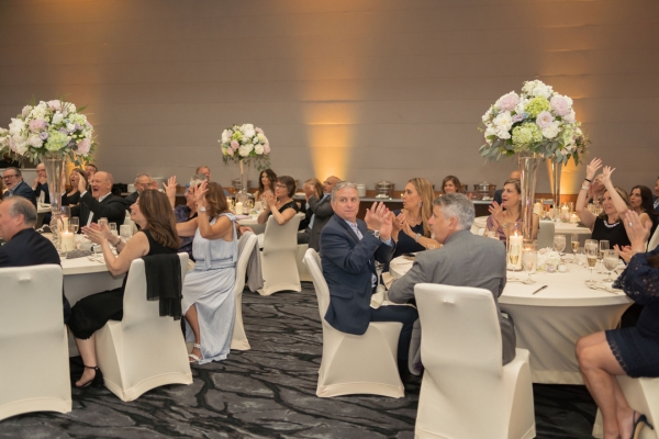 Wedding guests seated during cocktail hour