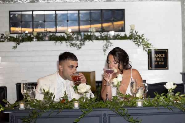 Newlyweds enjoying cocktails at reception