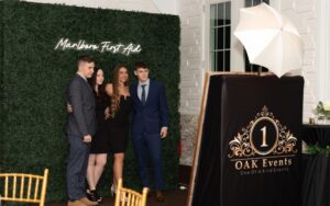 photo booth with green wall backdrop