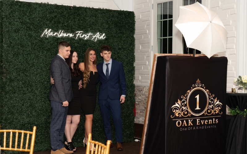 photo booth with green wall backdrop