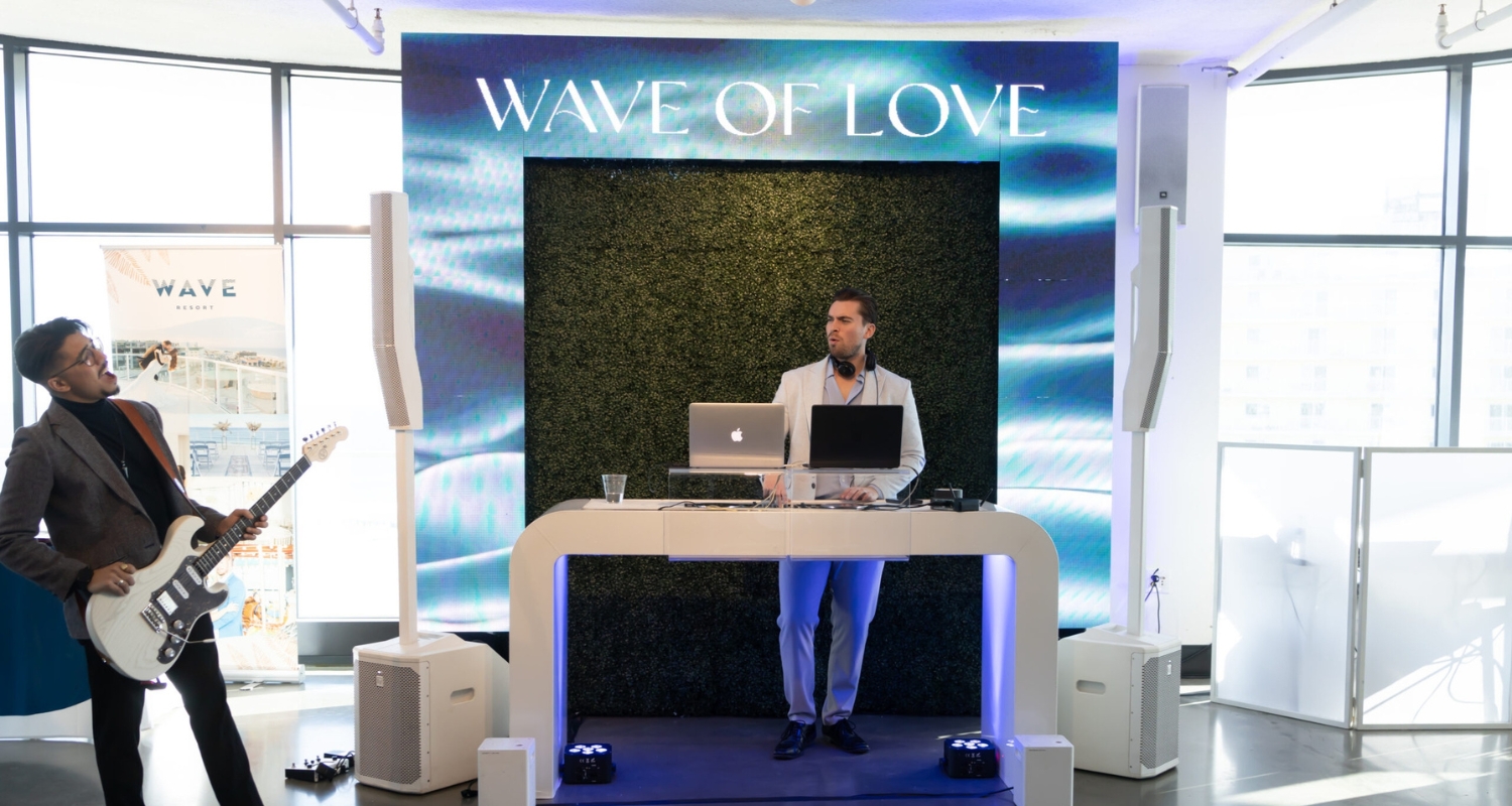 dj and musician behind wall