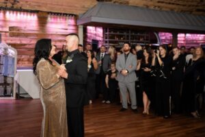 Groom and mother dance during wedding reception