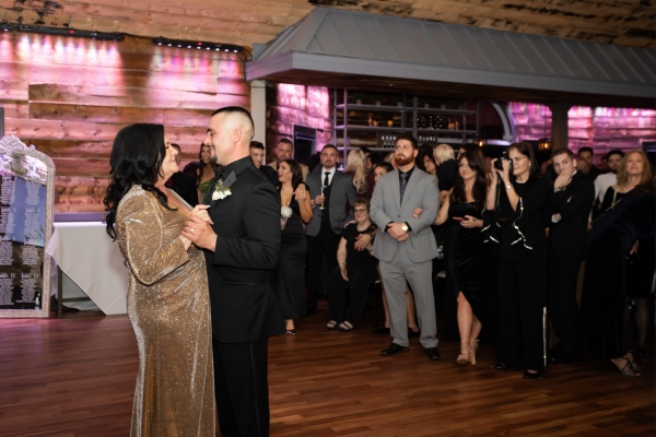 Groom and mother dance during wedding reception
