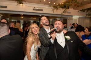 Bride singing with wedding MC
