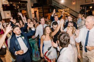 saxophonist with wedding crowd hyped