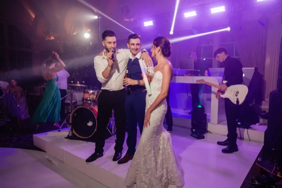 MC with wedding couple on stage