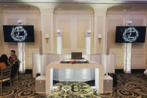 White furniture DJ booth in ballroom