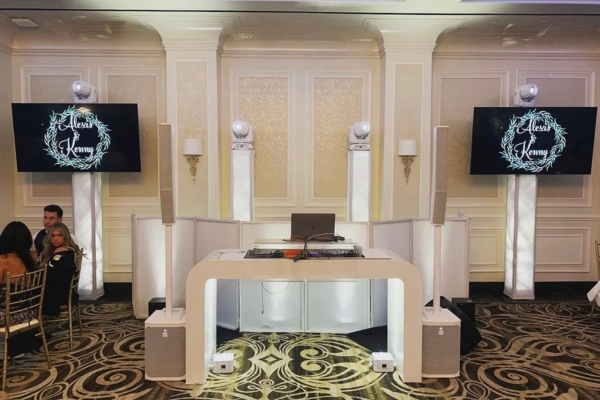 White furniture DJ booth in ballroom