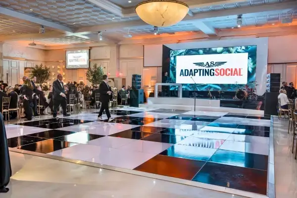 Event stage with LED screen and checkerboard dance floor