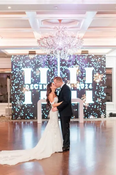 LED video wall behind wedding couple