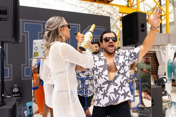Tommy and Kelly celebrating on stage