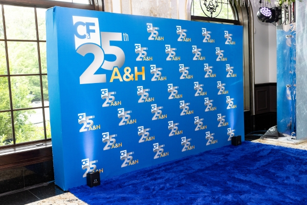 Blue A&H 25th anniversary step and repeat backdrop