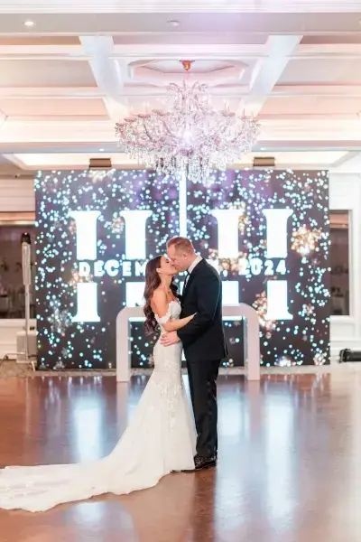 LED video wall behind newlywed couple