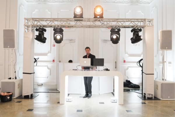 DJ booth with overhead lighting truss